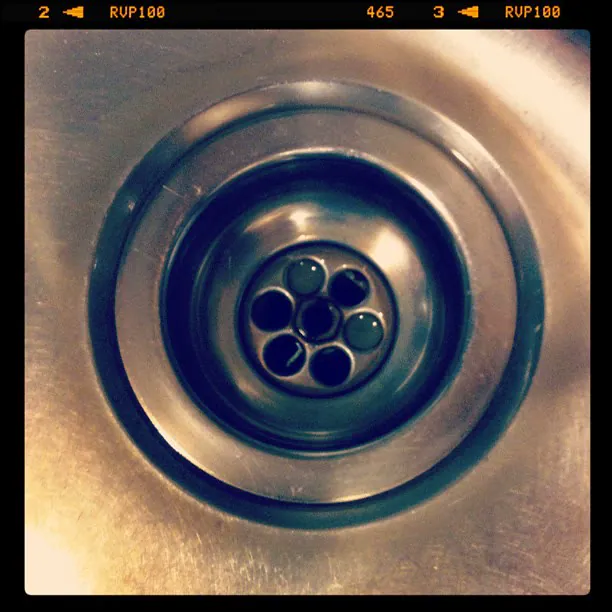 Close-up of a stainless steel sink drain