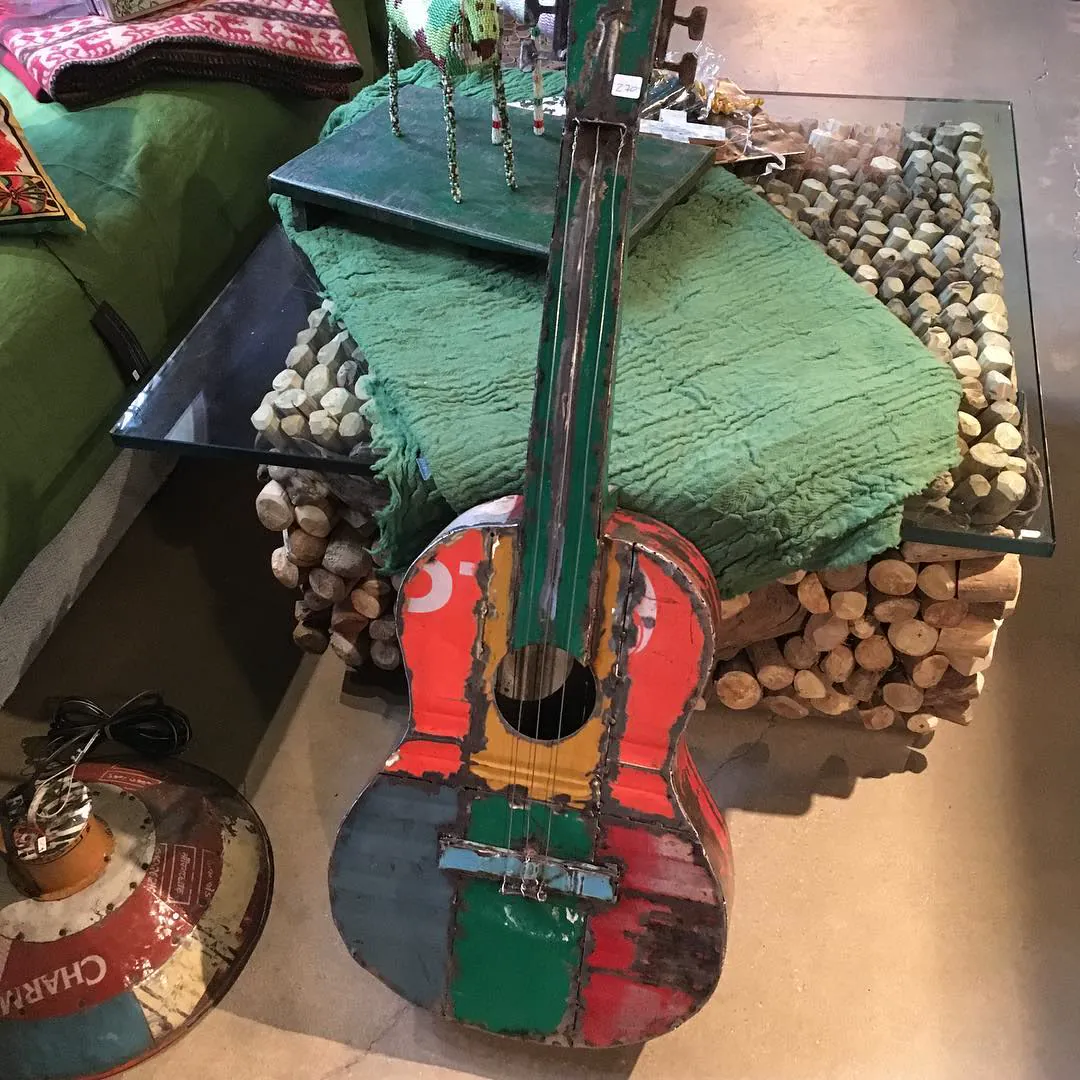 A guitar made from old painted tin cans