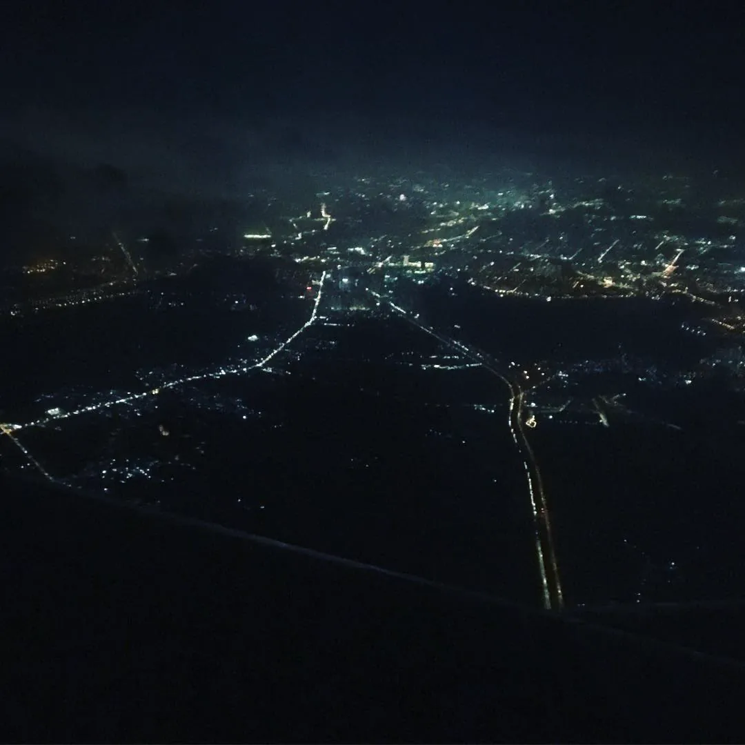 The lights of Saigon at night, seen from a landing plane